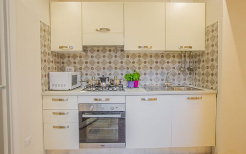 Casa Ettore: Elettrodomestico Da Cucina, Cucina, Apparecchio Major, Controsoffitto, Cabinetry, Legna, Pavimentazione, Interior Design, Pavimento, Cucina Stufa