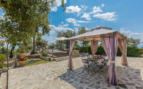 Villa Bastiano: Flagstone, Shade, Struttura Esterna, Giardino, Vaso Di Fiori, Sedia, Gazebo, Mobili Da Esterno, Landscaping, Terrazza