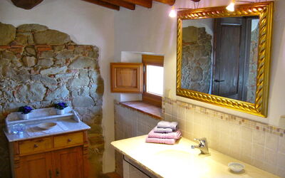 Bathroom with a sink in real travertine