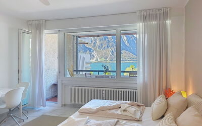 Blue Lake Lugano Apt.312 50.16: Mobilia, Interior Design, Camera, Pavimento, Soffitto, Pavimentazione, Illuminazione, Appartamento, Cuscino, Letto